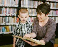 parent or teacher reading with child
